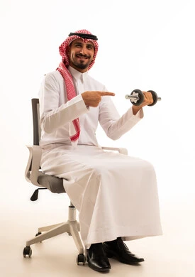 Saudi Man in Traditional Thobe Lifting Dumbbell