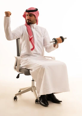 Saudi Man in Traditional Thobe Lifting Dumbbell
