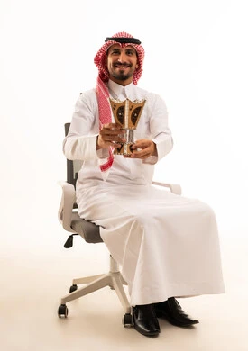 Saudi Man Holding Traditional Incense Burner in Studio
