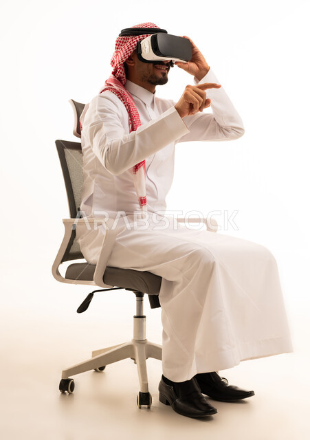 Saudi Man Using VR Headset in Office Chair