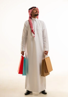 Saudi Man with Shopping Bags on White Background