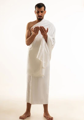 Arab Muslim Man in White Ihram Praying