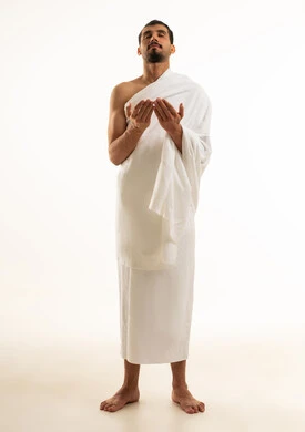 Muslim Man in Ihram Praying on White Background