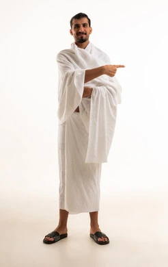 Saudi Man in Ihram Pointing on White Background