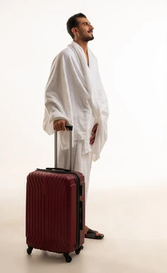Saudi Man in Ihram with Red Suitcase for Hajj
