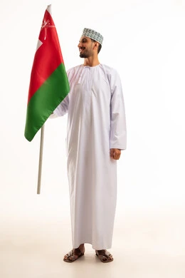 Omani Man Holding National Flag on White Background