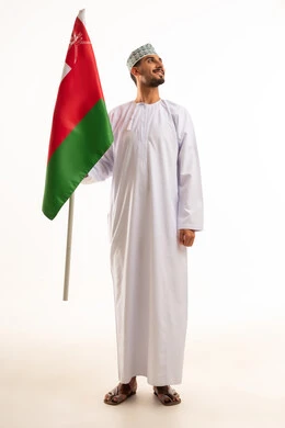 Omani Man in Traditional Dishdasha Holding Oman Flag