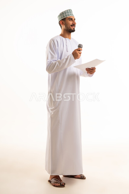 Omani Man in Traditional Dress with Microphone