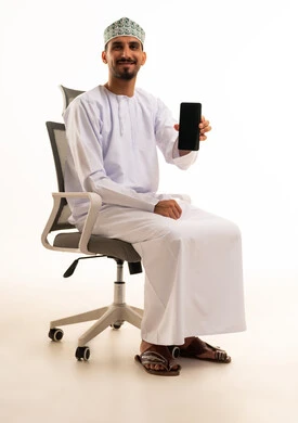 Omani Man Holding Smartphone on Office Chair