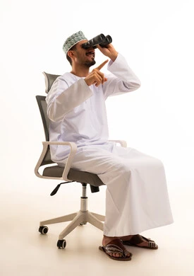 Omani Man with Binoculars on Office Chair