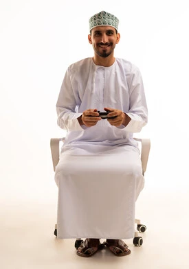 Omani Man Playing Video Games on White Background