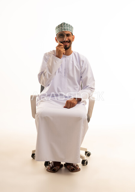 Omani Man with Magnifying Glass on White Background