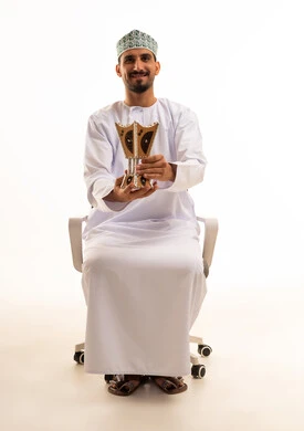 Omani Man in Traditional Dress Holding Incense Burner