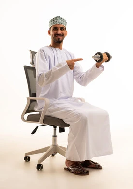 Omani Man in Dishdasha with Dumbbell in Office Chair