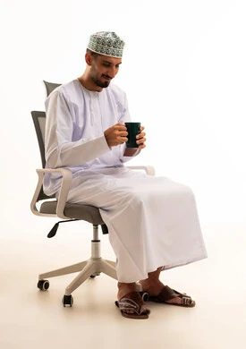 Omani Man in Traditional Dishdasha with Coffee Mug