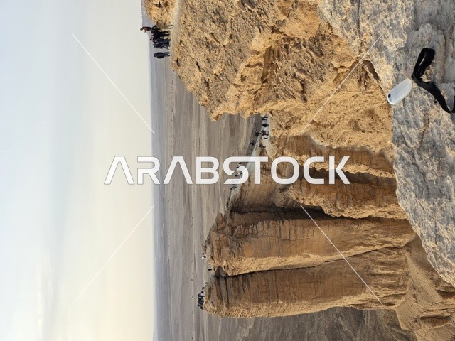 Tuwaiq Mountains in Najd in the Kingdom of Saudi Arabia, the Edge of the World, desert areas, rocky mountains and elevations, rocky peaks, historical landmarks, tourism in Saudi Arabia, tourism in the Kingdom of Saudi Arabia.