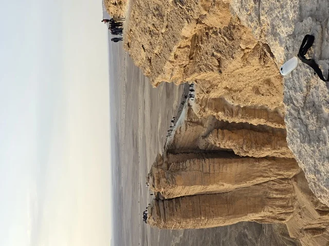 Tuwaiq Mountains in Najd in the Kingdom of Saudi Arabia, the Edge of the World, desert areas, rocky mountains and elevations, rocky peaks, historical landmarks, tourism in Saudi Arabia, tourism in the Kingdom of Saudi Arabia.