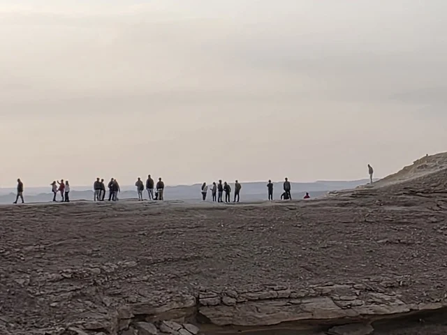 A famous natural tourist destination, the Grand Canyon overlook, a natural view of the Edge of the World, the Tuwaiq Mountains in Riyadh, mountains in Najd in the Kingdom of Saudi Arabia, desert areas, rocky mountains and elevations, rocky peaks, historical landmarks, tourism in Saudi Arabia.