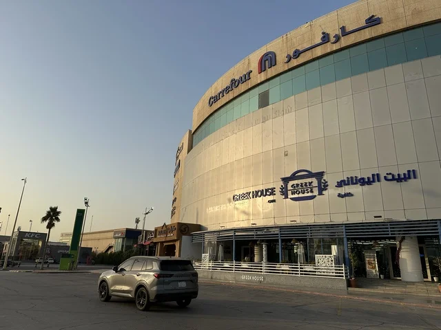 The entrance of the Greek House Coffee at the Shore Mall in Dammam, Eastern Province, Saudi Arabia, is a comprehensive commercial and entertainment center, featuring local and international stores and brands, diverse restaurants and cafes, recreational areas for children and families, seasonal events and marketing activities, and a family-friendly atmosphere for all age groups.