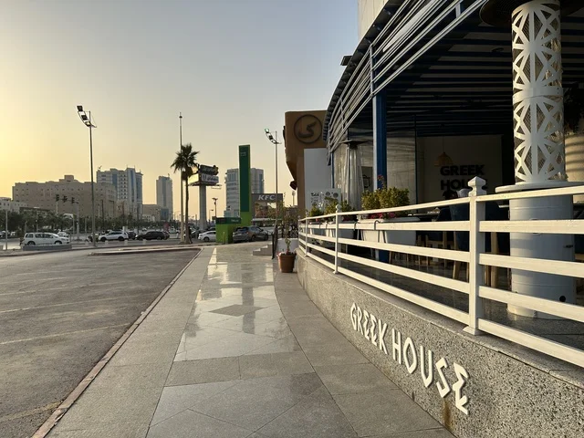 The entrance of the Greek House Coffee at the Shore Mall in Dammam, Eastern Province, Saudi Arabia, is a comprehensive commercial and entertainment center, featuring local and international stores and brands, diverse restaurants and cafes, recreational areas for children and families, seasonal events and marketing activities, and a family-friendly atmosphere for all age groups.
