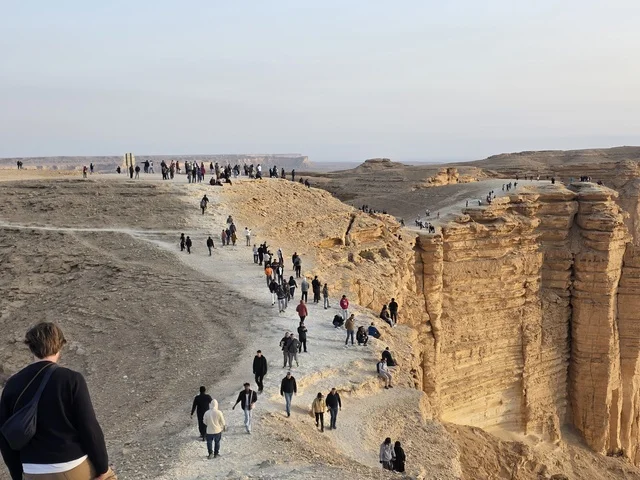 Rocky peaks, mountains and rocky elevations, desert areas, the Edge of the World, Tuwaiq Mountains in Najd in the Kingdom of Saudi Arabia, historical landmarks, tourism in Saudi Arabia, tourism in the Kingdom of Saudi Arabia.