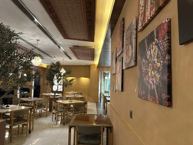 Elegant coffee seats at Al-Shatea Mall in Dammam City, Eastern Province, Saudi Arabia, a comprehensive commercial and entertainment center, diverse restaurants and cafes, recreational areas for children and families, seasonal events and marketing activities, local and international stores and brands, a family-friendly atmosphere for all categories.