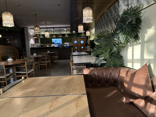 Elegant coffee seats at Al-Shatea Mall in Dammam City, Eastern Province, Saudi Arabia, a comprehensive commercial and entertainment center, diverse restaurants and cafes, recreational areas for children and families, seasonal events and marketing activities, local and international stores and brands, a family-friendly atmosphere for all categories.