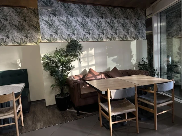 Elegant coffee seats at Al-Shatea Mall in Dammam City, Eastern Province, Saudi Arabia, a comprehensive commercial and entertainment center, diverse restaurants and cafes, recreational areas for children and families, seasonal events and marketing activities, local and international stores and brands, a family-friendly atmosphere for all categories.