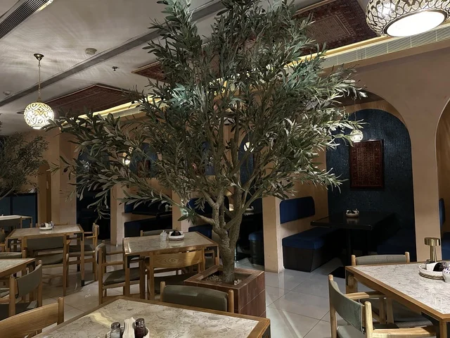 Elegant decor in a café at the Beach Mall in Dammam, Eastern Province, Saudi Arabia, a complete commercial and entertainment center, diverse restaurants and cafés, recreational areas for children and families, seasonal events and marketing activities, local and international stores and brands, family-friendly atmosphere for all categories.