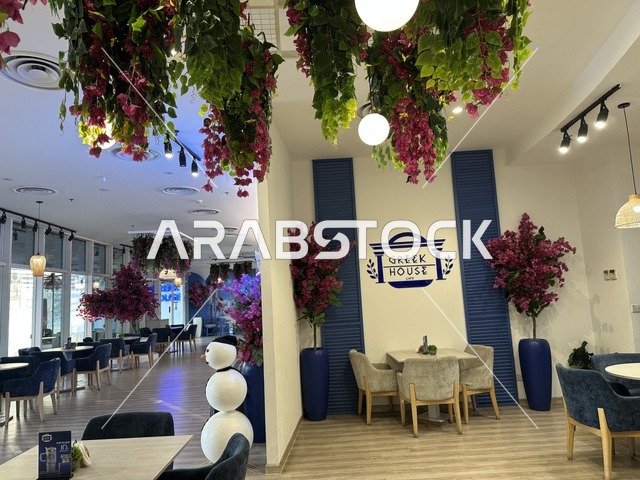 Elegant decor in a café at the Beach Mall in Dammam, Eastern Province, Saudi Arabia, a complete commercial and entertainment center, diverse restaurants and cafés, recreational areas for children and families, seasonal events and marketing activities, local and international stores and brands, family-friendly atmosphere for all categories.