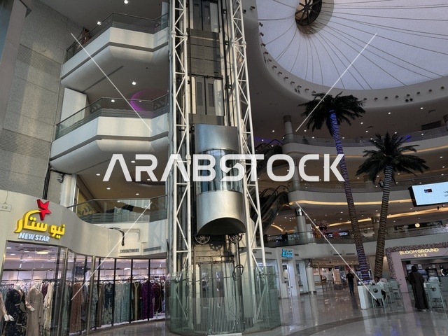 The elevator at the Beach Mall in Dammam, Eastern Province, Saudi Arabia, is a comprehensive commercial and entertainment center, featuring a variety of restaurants and cafes, recreational areas for children and families, seasonal events and marketing activities, local and international stores and brands, and a family-friendly atmosphere for all age groups.