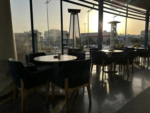 A classy café in the Shore Mall in Dammam, Eastern Province, Saudi Arabia, is a complete commercial and entertainment center, featuring diverse restaurants and cafes, recreational areas for children and families, seasonal events and marketing activities, local and international stores and brands, and a family-friendly atmosphere for all age groups.