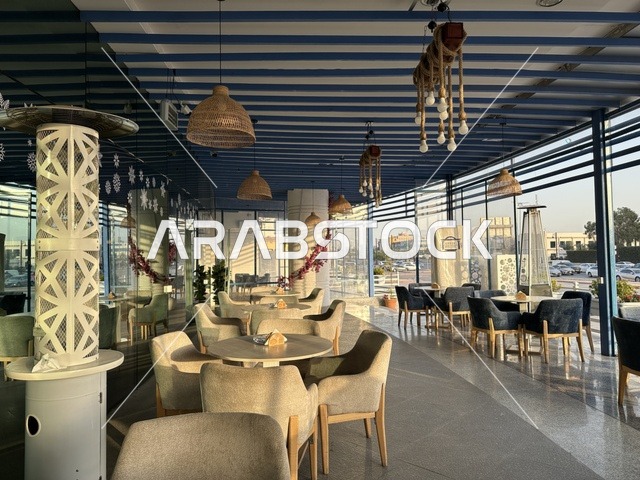 A classy café in the Shore Mall in Dammam, Eastern Province, Saudi Arabia, is a complete commercial and entertainment center, featuring diverse restaurants and cafes, recreational areas for children and families, seasonal events and marketing activities, local and international stores and brands, and a family-friendly atmosphere for all age groups.