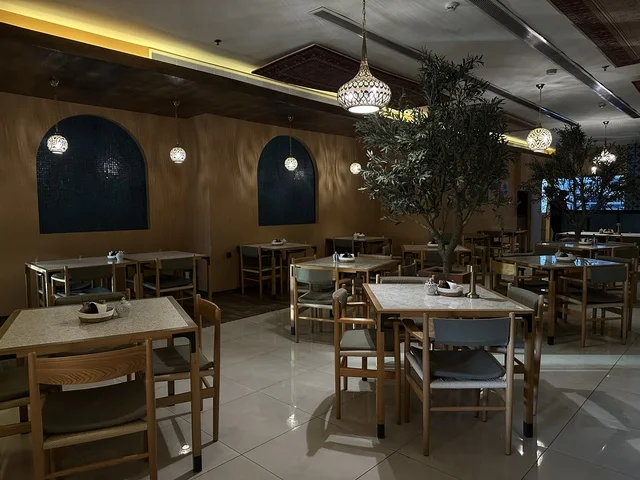 A classy café in the Shore Mall in Dammam, Eastern Province, Saudi Arabia, is a complete commercial and entertainment center, featuring diverse restaurants and cafes, recreational areas for children and families, seasonal events and marketing activities, local and international stores and brands, and a family-friendly atmosphere for all age groups.