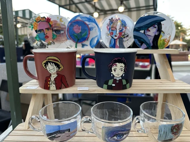 Outdoor shopping corners at the Jood Market in Prince Saud Park in Dhahran, Eastern Province, Saudi Arabia, an open community market that supports local projects, artisanal products, and homemade foods, family events and recreational activities, with a vibrant heritage and social atmosphere.