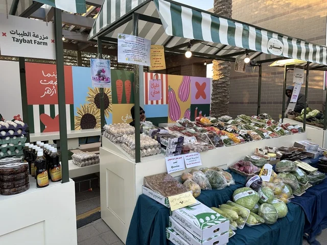 Shop for local products at the Jood Market in Prince Saud Park in Dhahran, Eastern Province, Saudi Arabia. It features artisanal products and homemade foods, outdoor shopping corners, family events, and recreational activities. It is an open community market that supports local projects, with a vibrant heritage and social atmosphere.