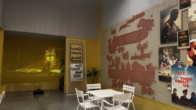 Cinema district in a beautiful neighborhood in Jeddah, Saudi Arabia, a contemporary cultural and artistic destination, featuring art exhibitions and creative spaces, diverse cultural and community events, cafes and artistic gathering areas, an urban environment that embraces creativity and modern arts.