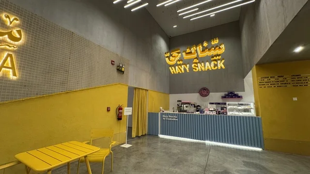 Cinema district in a beautiful neighborhood in Jeddah, Saudi Arabia, a contemporary cultural and artistic destination, featuring art exhibitions and creative spaces, diverse cultural and community events, cafes and artistic gathering areas, an urban environment that embraces creativity and modern arts.