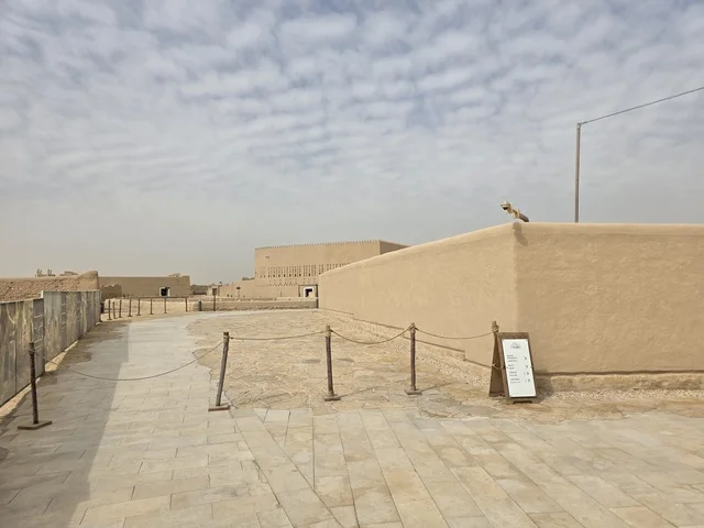 The dry desert and the cloudy sky, the history of the First Saudi State, the ancient walls of Diriyah in the city of Riyadh in the Kingdom of Saudi Arabia, ancient historical archaeological landmarks, ancient architectural engineering art, a picture of the archaeological buildings and mud houses in the Al-Turaif neighborhood in Diriyah.