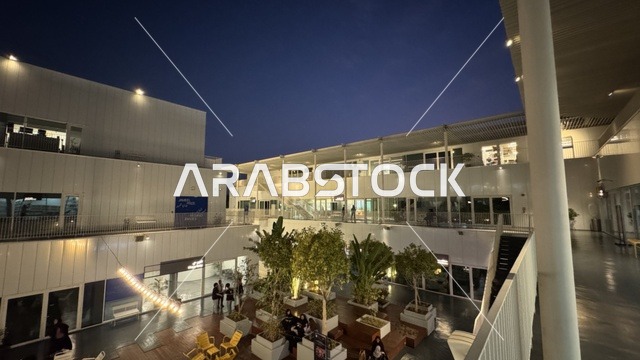 The interior design of a beautiful neighborhood in Jeddah, Saudi Arabia, a contemporary cultural and artistic destination, featuring art galleries and creative spaces, diverse cultural and community events, cafes and artistic gathering areas, an urban environment that embraces creativity and modern arts.