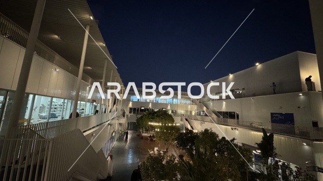 The interior design of a beautiful neighborhood in Jeddah, Saudi Arabia, a contemporary cultural and artistic destination, featuring art galleries and creative spaces, diverse cultural and community events, cafes and artistic gathering areas, an urban environment that embraces creativity and modern arts.