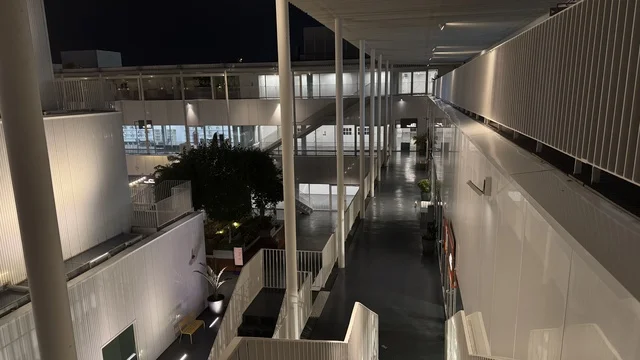 The stairs in a beautiful neighborhood in Jeddah, Saudi Arabia, a contemporary cultural and artistic destination, featuring art exhibitions and creative spaces, an urban environment that embraces creativity and modern arts, diverse cultural and community events, cafes, and artistic gathering areas.