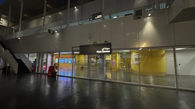 Cinema district in a beautiful neighborhood in Jeddah, Saudi Arabia, a contemporary cultural and artistic destination, an urban environment that embraces creativity and modern arts, art exhibitions and creative spaces, diverse cultural and community events, cafes and artistic gathering areas.