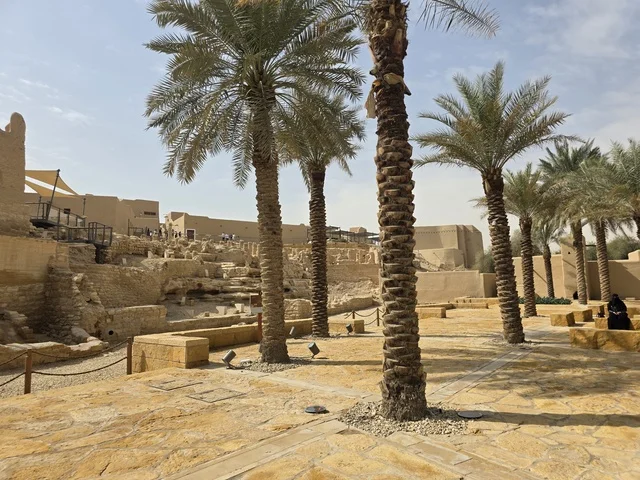 Cultivation of palm trees, ancient historical archaeological sites, the old walls of Diriyah in the city of Riyadh in the Kingdom of Saudi Arabia, ancient architectural engineering art, a picture of the archaeological buildings and mud houses in the Al-Turaif neighborhood in Diriyah, the history of the First Saudi State. Cultivation of palm trees, ancient historical archaeological sites, the old walls of Diriyah in the city of Riyadh in the Kingdom of Saudi Arabia, ancient architectural engineering art, a picture of the archaeological buildings and mud houses in the Al-Turaif neighborhood in Diriyah, the history of the First Saudi State.