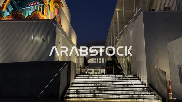 Stairs at the entrance of a beautiful building in Jeddah, Saudi Arabia, a contemporary cultural and artistic destination, an urban environment that embraces creativity and modern arts, art exhibitions and creative spaces, diverse cultural and community events, cafes and artistic gathering areas.