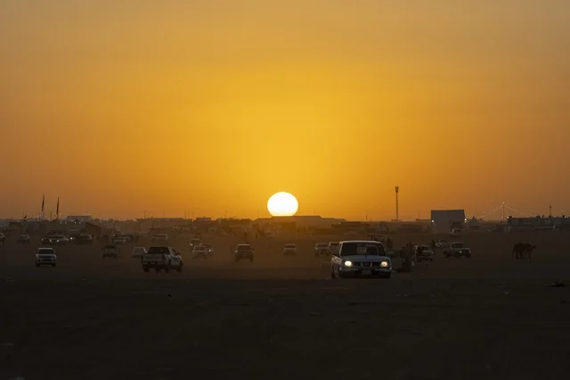 Traffic of cars on the external road for the King Abdulaziz Festival for Camel Beauty, Kingdom of Saudi Arabia, a major national heritage event, with wide participation from camel owners, shows and auctions, cultural and heritage activities, competitions and the beauty of camels, festive atmosphere reflecting the authenticity of the Saudi heritage.