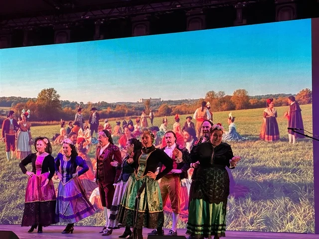 A folk dance show at the Spain Street event in the King Abdulaziz Center for World Culture "Ithra" in Dhahran, Eastern Province, Saudi Arabia, on October 11, 2025, interactive activities for families and children, flamenco dances, live musical and artistic performances, Spanish-themed restaurants and cafes, and a vibrant festive atmosphere.