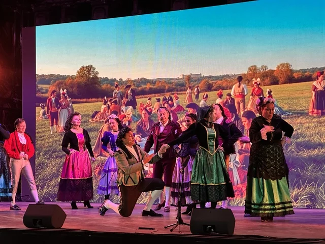 A folk dance show at the Spain Street event in the King Abdulaziz Center for World Culture "Ithra" in Dhahran, Eastern Province, Saudi Arabia, on October 11, 2025, interactive activities for families and children, flamenco dances, live musical and artistic performances, Spanish-themed restaurants and cafes, and a vibrant festive atmosphere.