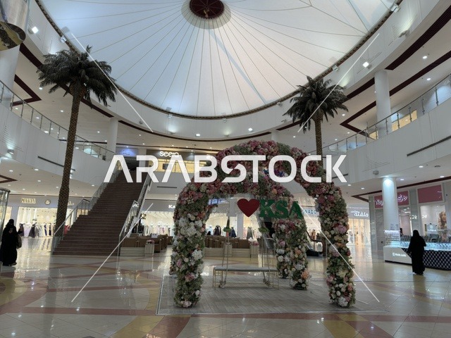Pink frame decor at Marina Mall in Dammam, Eastern Province, Saudi Arabia, a shopping and entertainment center overlooking the waterfront, featuring diverse shops and brands, restaurants and cafes with sea views, recreational and service facilities, a family destination that combines shopping and entertainment.