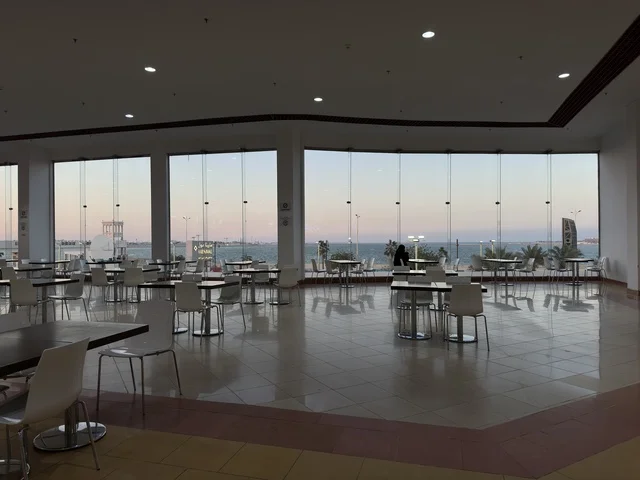 Places to relax in Marina Mall in Dammam City, Eastern Province, Saudi Arabia, a shopping and entertainment center overlooking the waterfront, with diverse shops and brands, restaurants and cafes with sea views, recreational and service facilities, a family destination that combines shopping and entertainment.